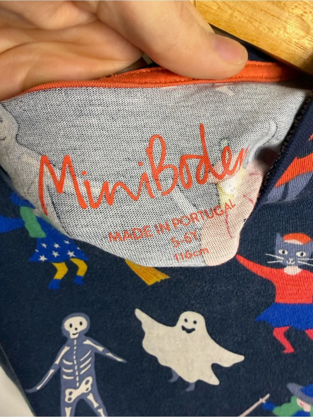 Mini Boden Halloween dress featuring pumpkins, ghosts, and skeletons, girls 5/6